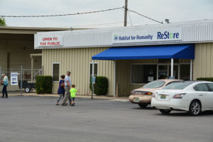 Front of ReStore with Family Walking in